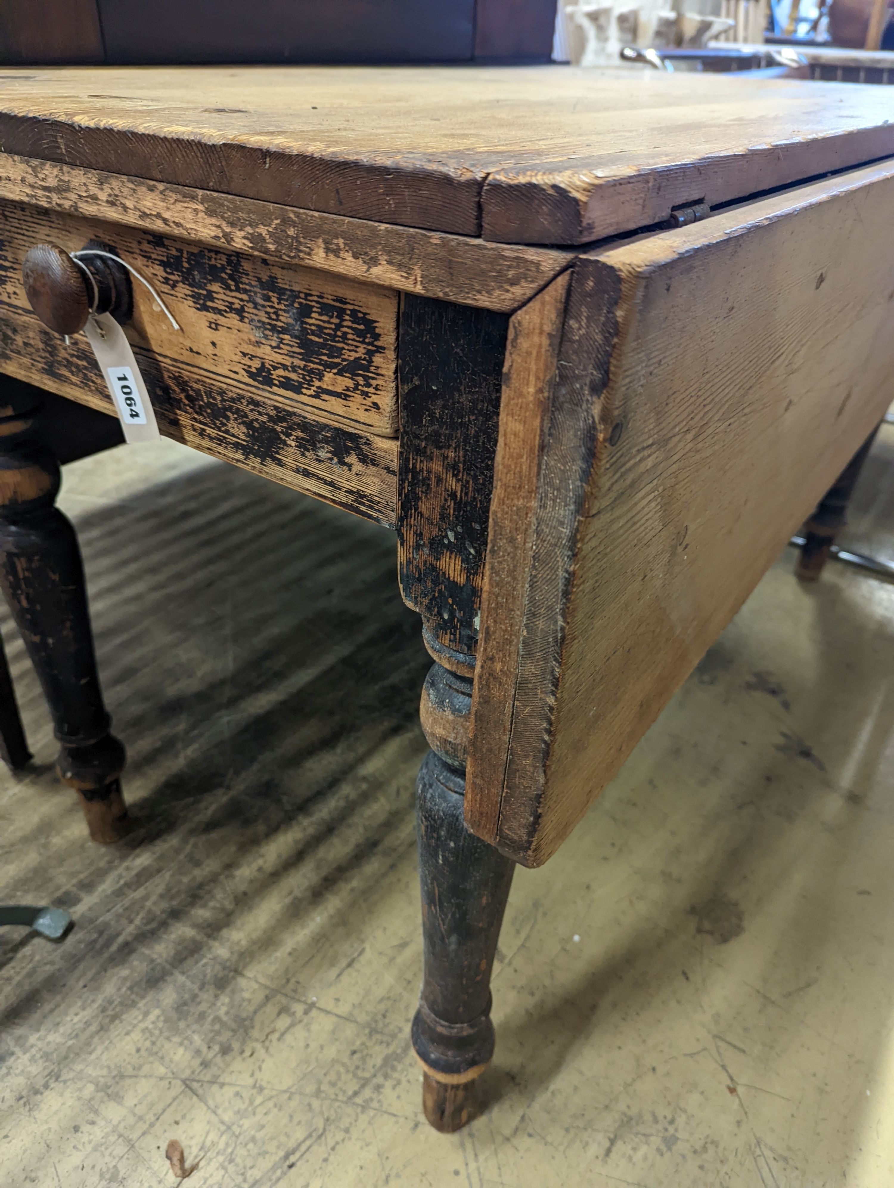 A Victorian pine drop flap kitchen table fitted drawer, width 122cm, length 117cm extended, height 70cm